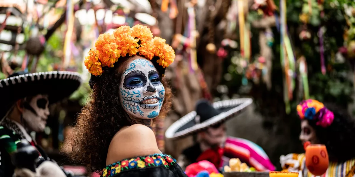 people in day of the dead makeup and outfits