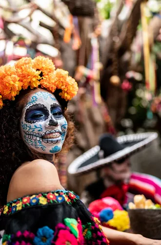 people in day of the dead makeup and outfits