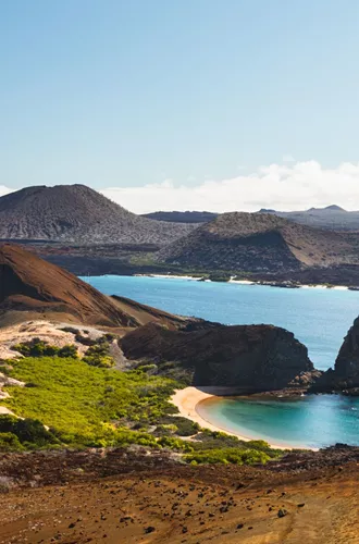 View On The Volcanic Landscape Of Bartolome Island With Famous Pinnacle Rock And Golden Beach