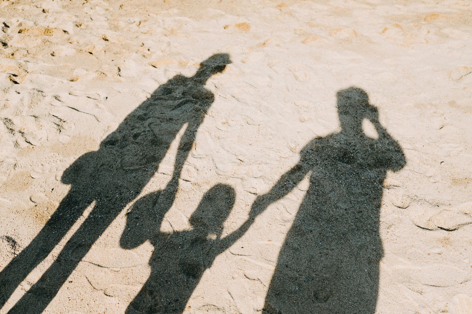 Family Shadow On Sandy Beach 