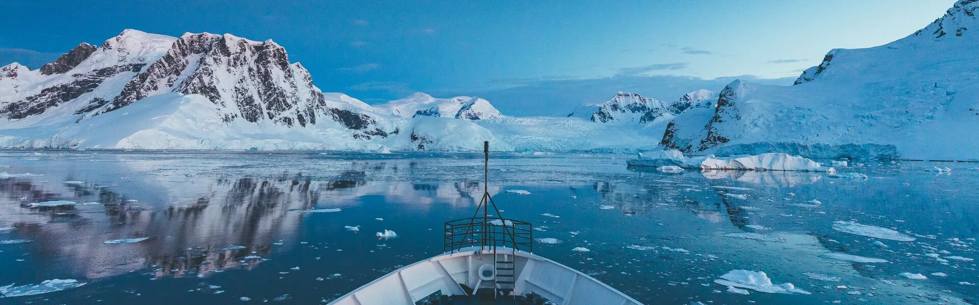 looking off the front of a ship at antarctic peninsula