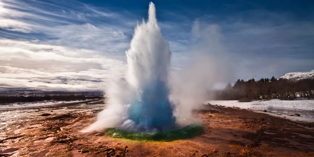 Strokkur Geyser shooting water into the air