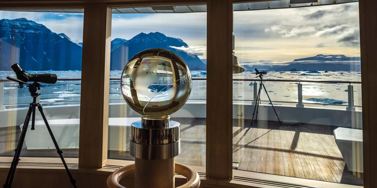 Crystal Globe And Spotting Scope In The Observation Lounge On The Ship National Geographic Endruance