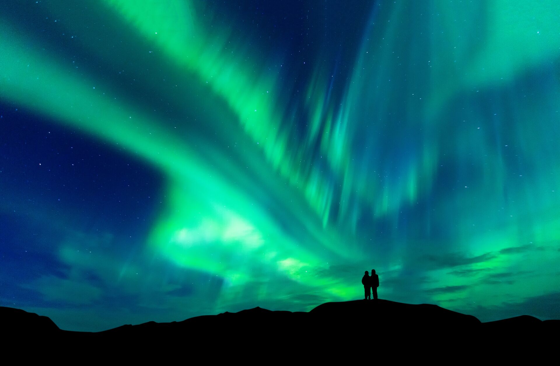couple looking at northern lights