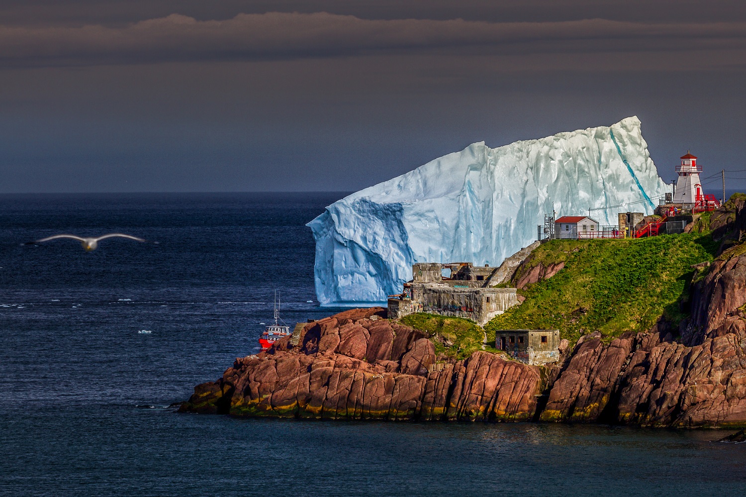 A large iceberg in the middle of a body of water