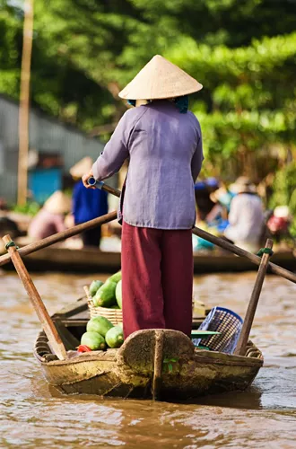 Vietnamese Woman Rowing Boat