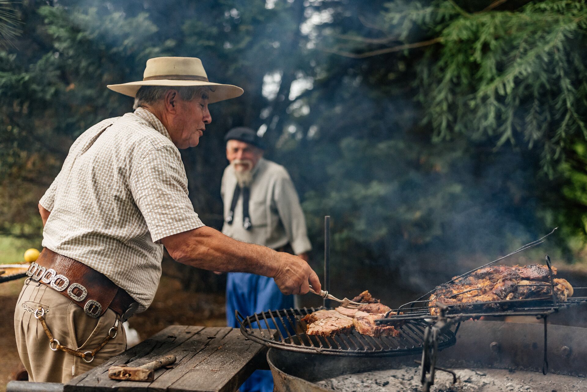 Gaucho cooking over a BBQ