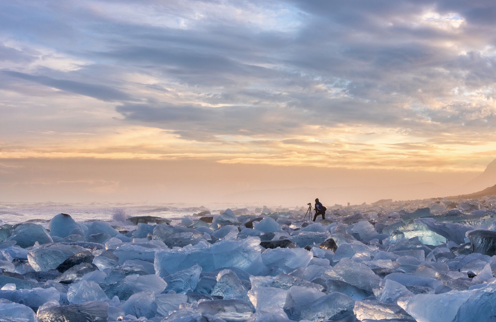 Scenic View Of Snow Covered Landscape Against Sky During Sunset