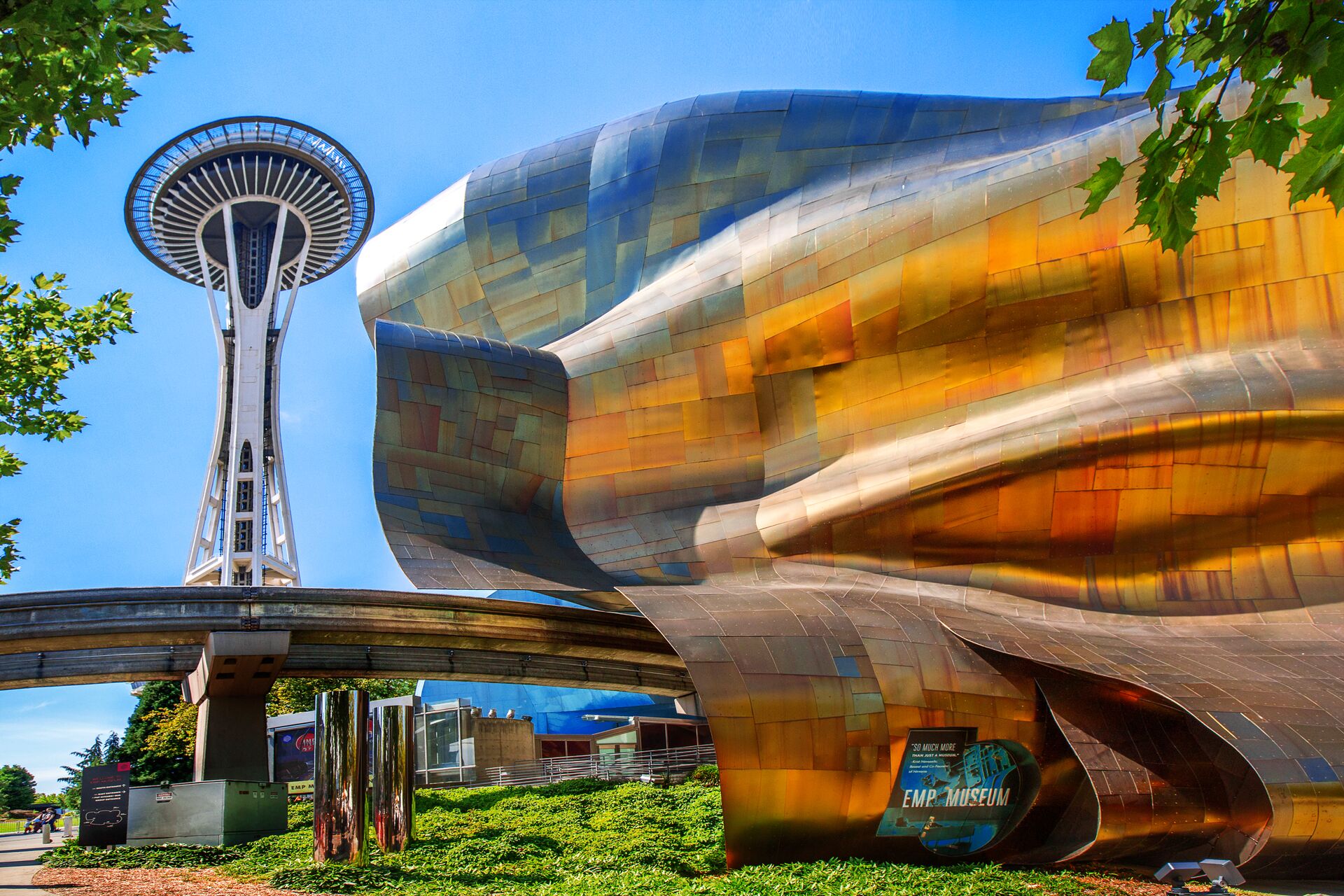 View Of Space Needle, Seattle Center Monorail And Exterior Of The EMP Museum Building