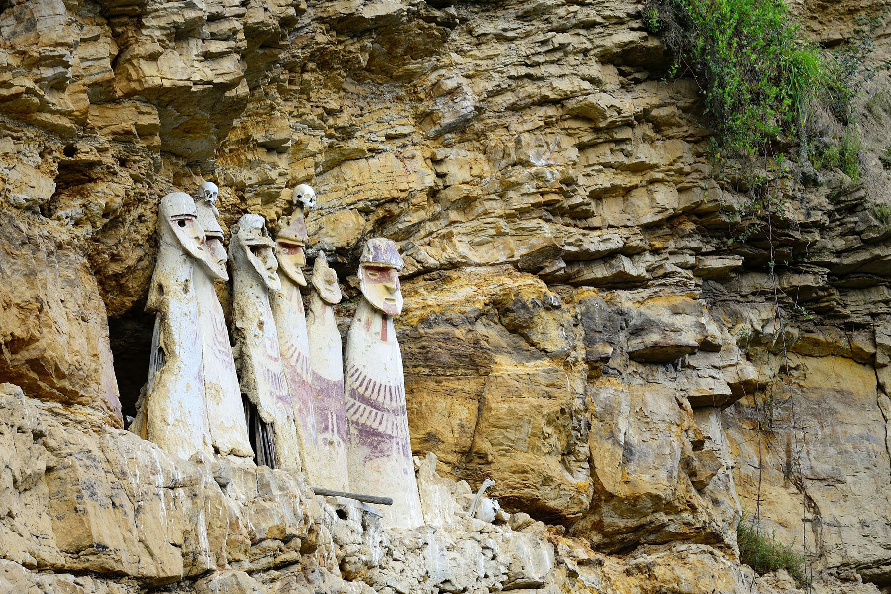 Figures carved into the side of the mountain