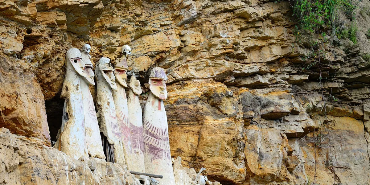 Figures carved into the side of the mountain