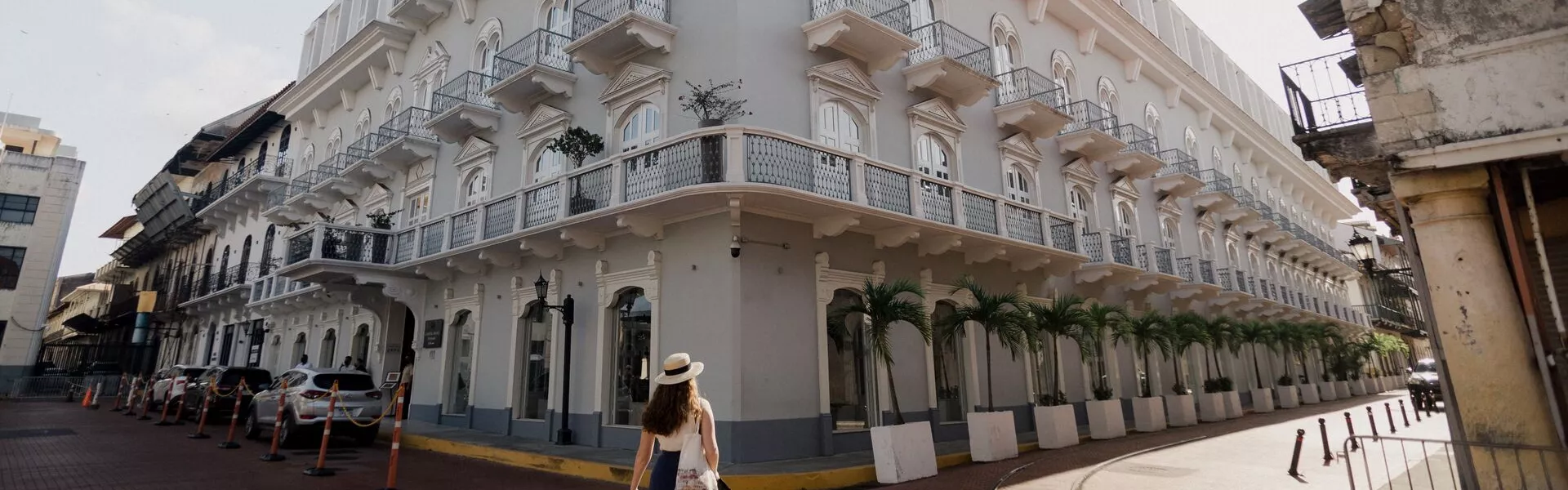 Person looking up at a colonial building
