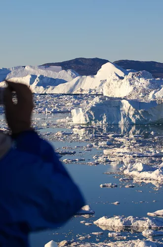 Looking Out From The Coast Of Ilulissat at icebergs