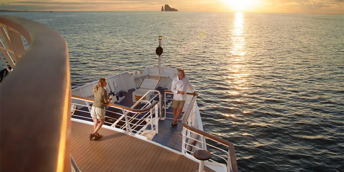 Passengers on the bow of a yacht