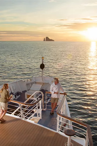 Passengers on the bow of a yacht