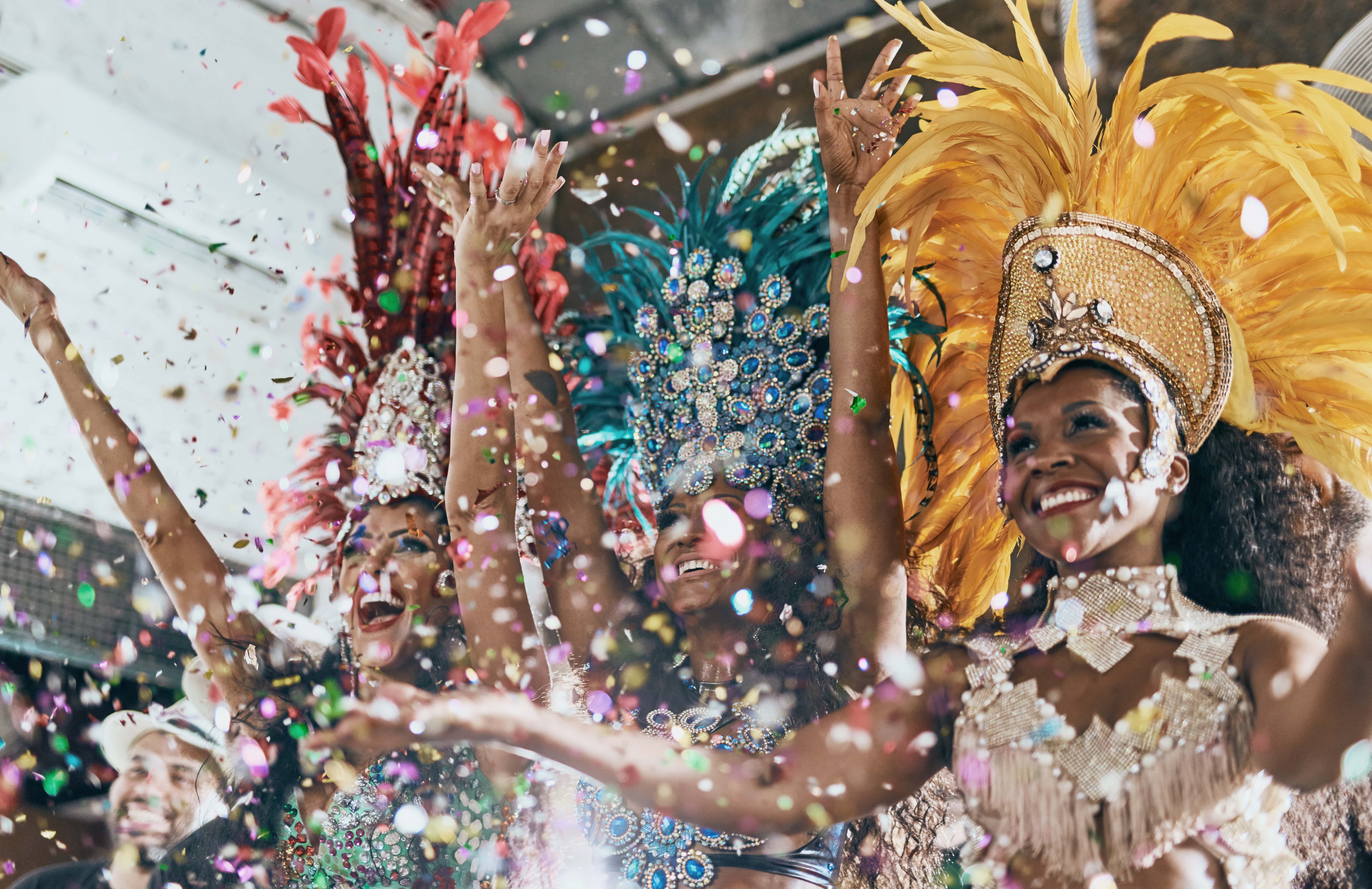 A group of people dressed in costumes and confetti around