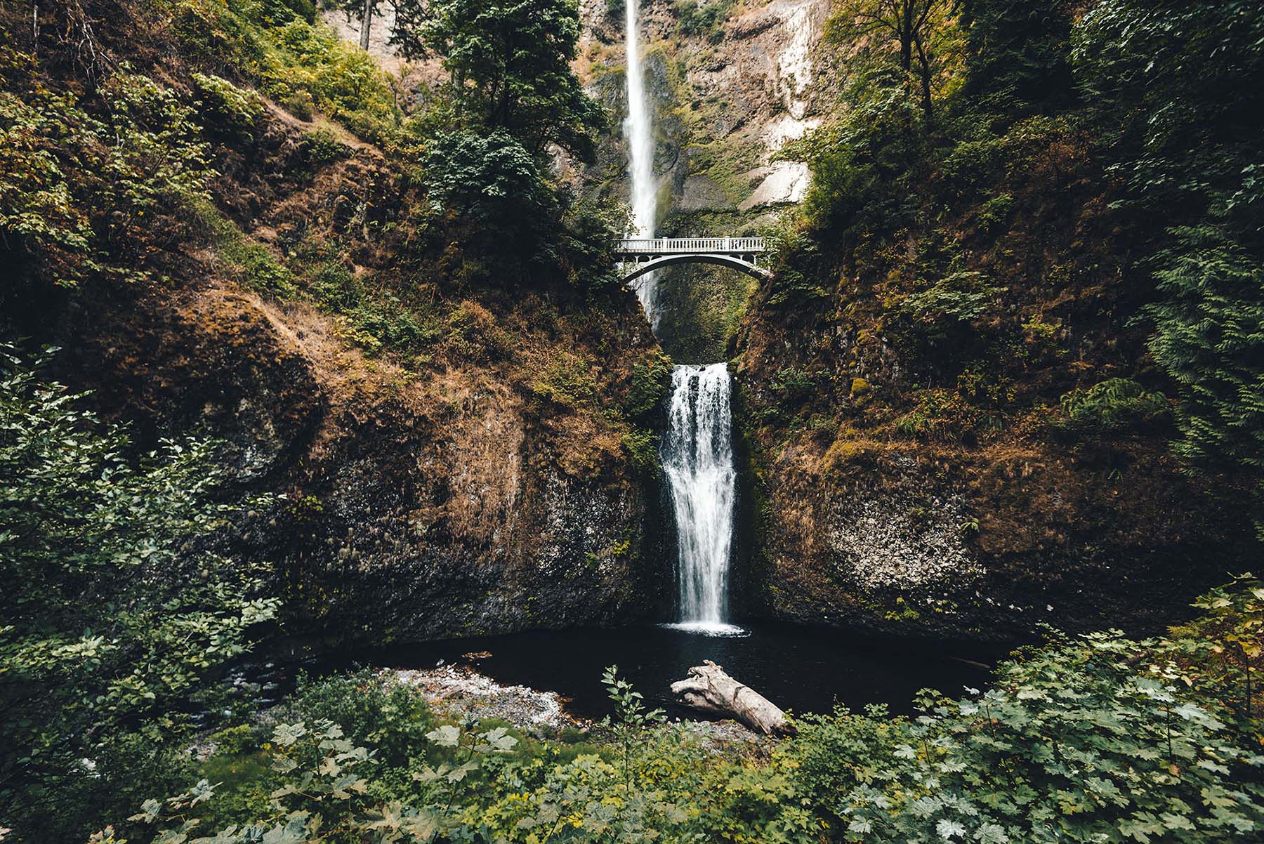 bridge across a waterfall