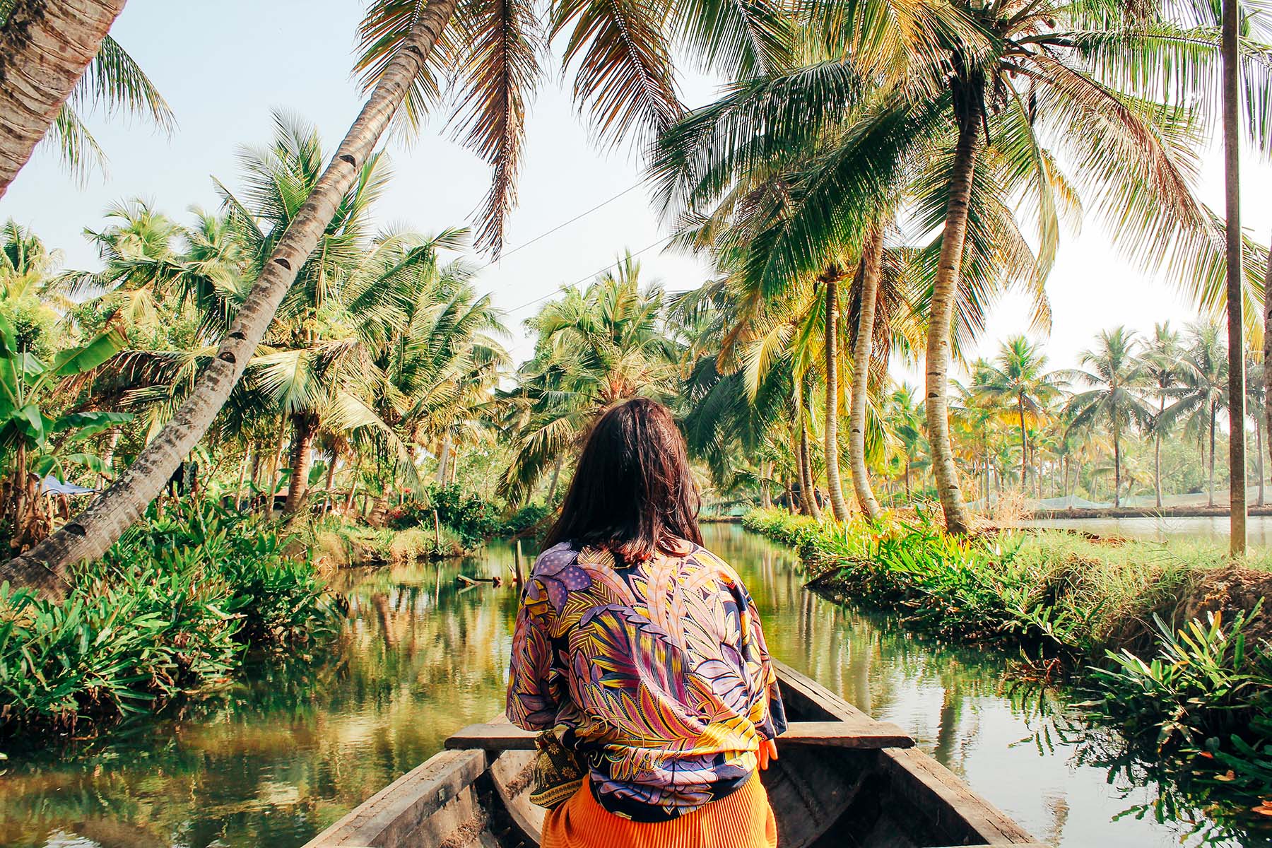 Woman In A Canoe Through The Back Waters of Kerala
